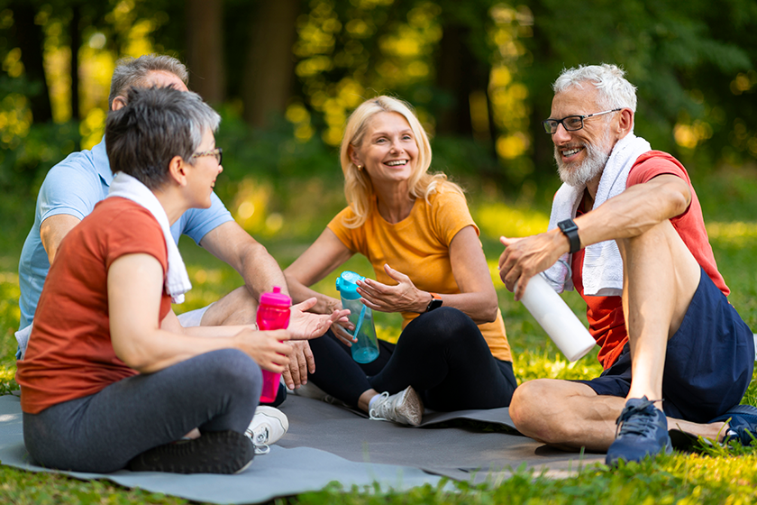 Joyful senior yoga enthusiasts enjoying