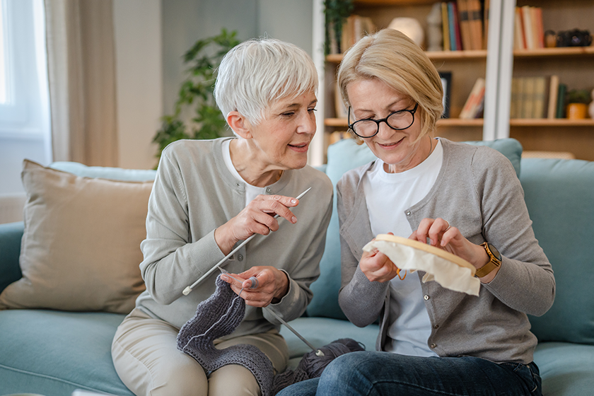 two-women-senior-mature-caucasian-friends-mother-daughter-sisters-knitting